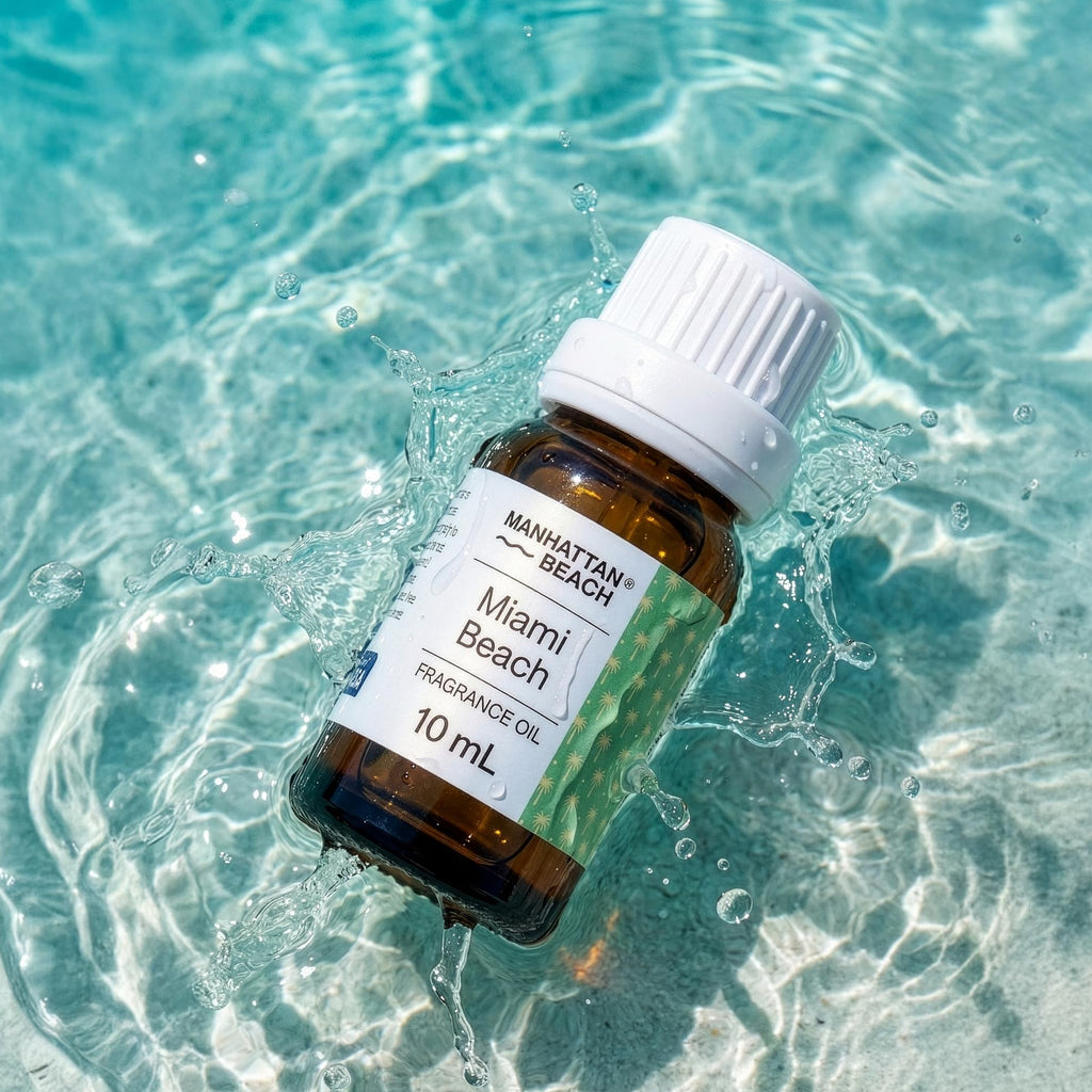Bottle of Manhattan Beach Miami Beach fragrance oil floating on clear water
