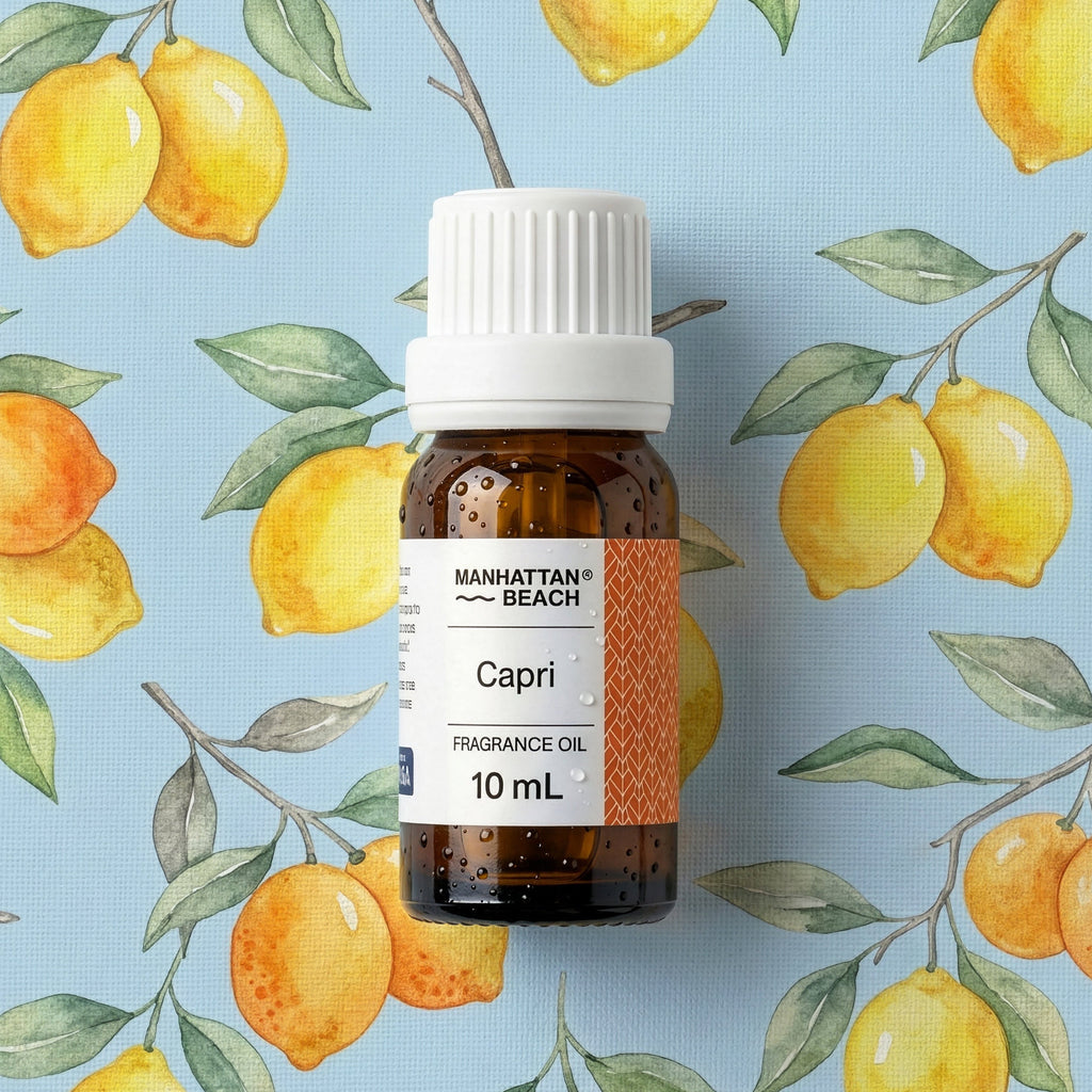 Bottle of Manhattan Beach Capri fragrance oil with lemon illustrations on a blue background