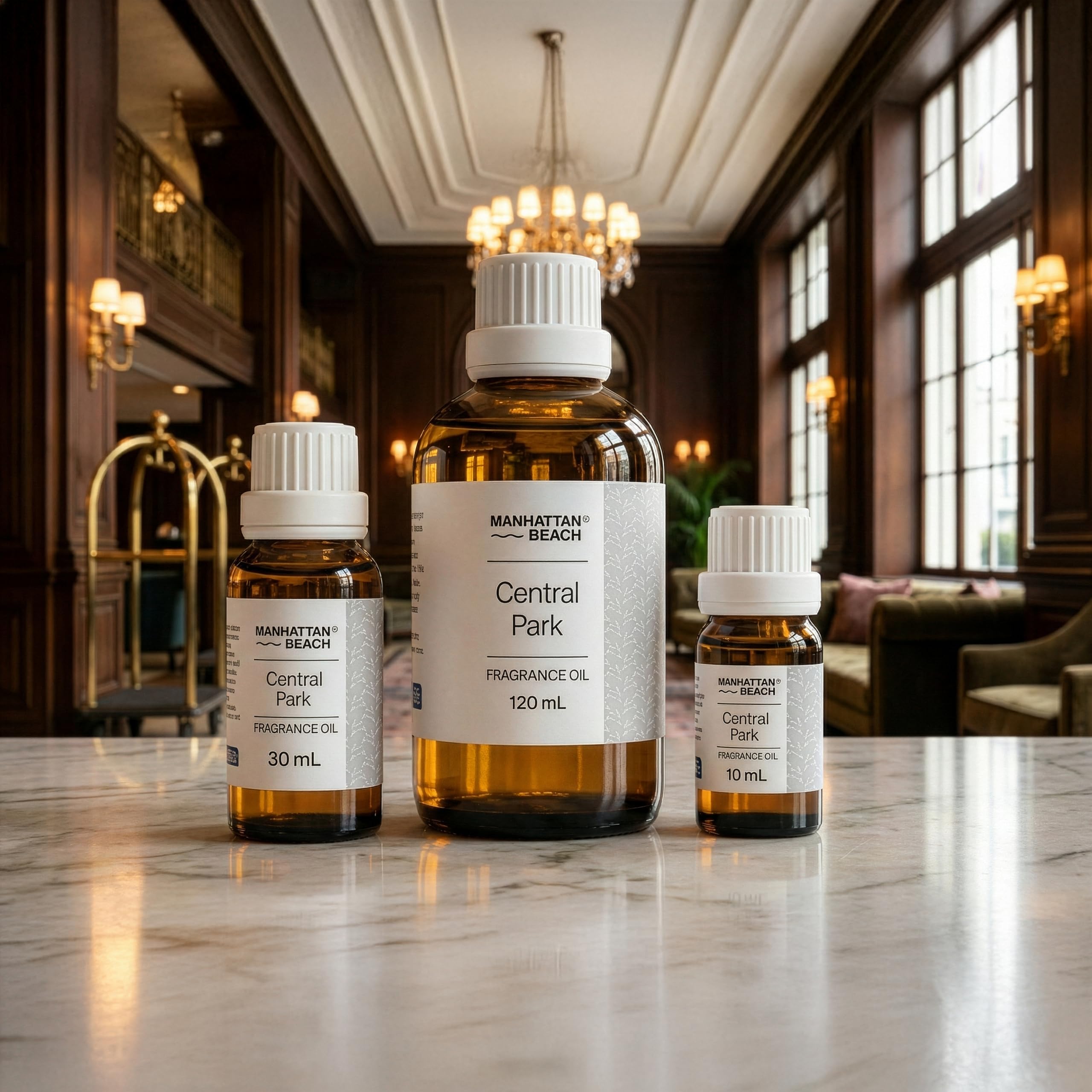 Three bottles of Manhattan Beach Central Park fragrance oil on a marble surface with a luxurious interior background.